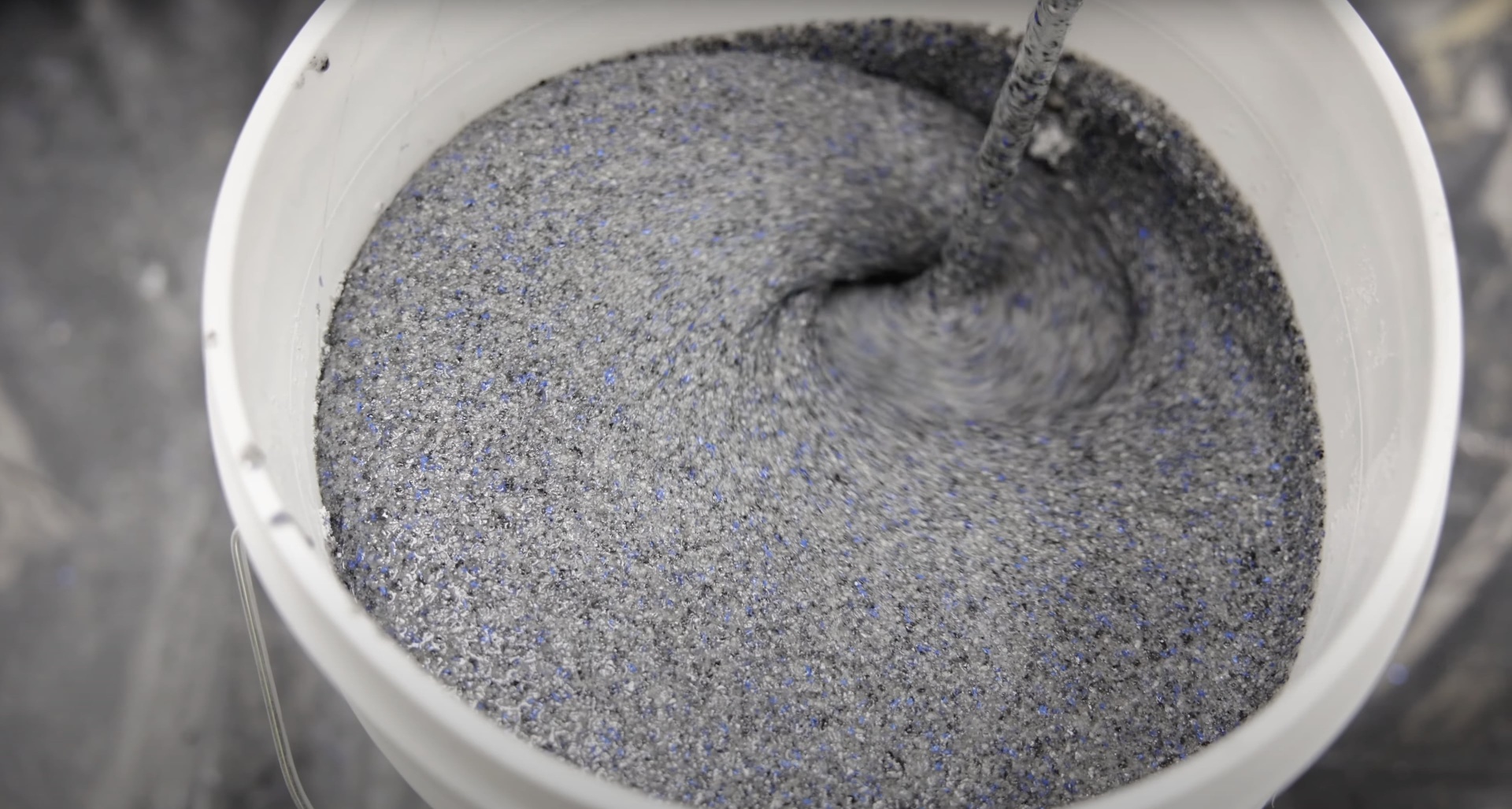 Professional concrete mixing process ensuring optimal strength and workability Fresh concrete being mixed in professional concrete mixer showing proper consistency