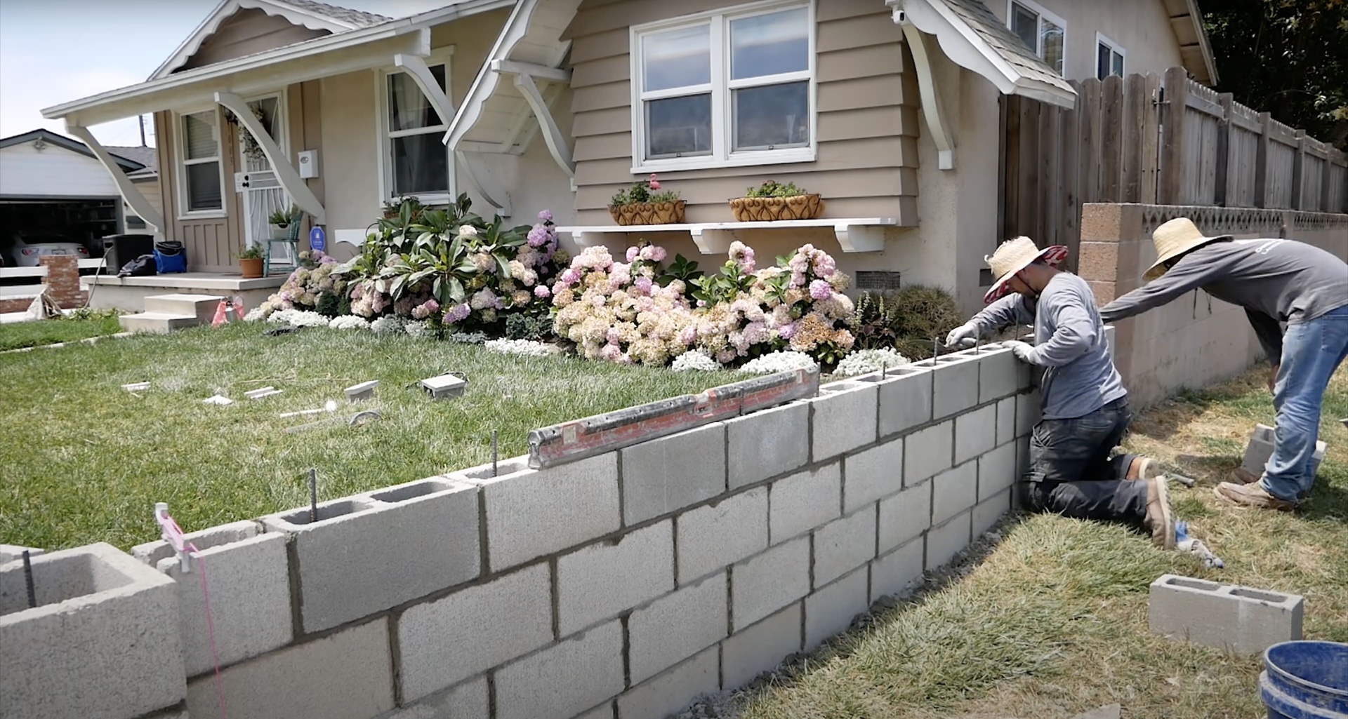 Concrete block retaining wall construction by professional contractors